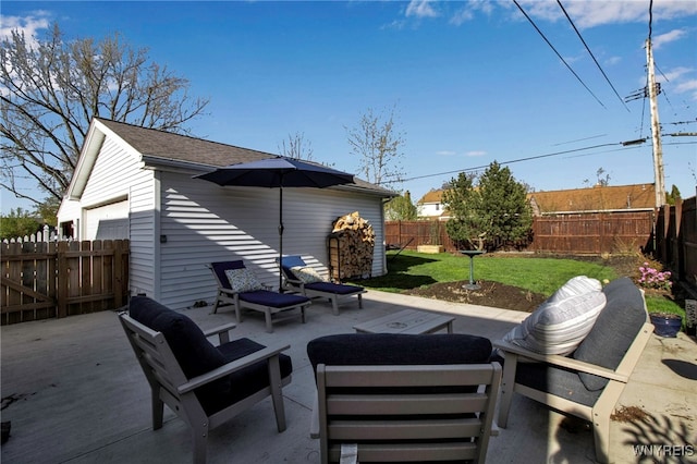 view of patio with an outdoor living space and a fenced backyard