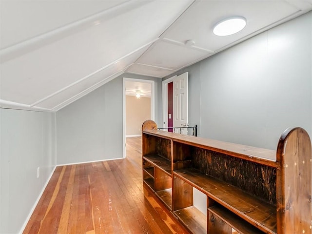 interior space with hardwood / wood-style floors and lofted ceiling