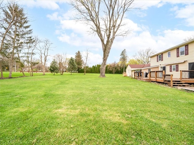 view of yard with a wooden deck