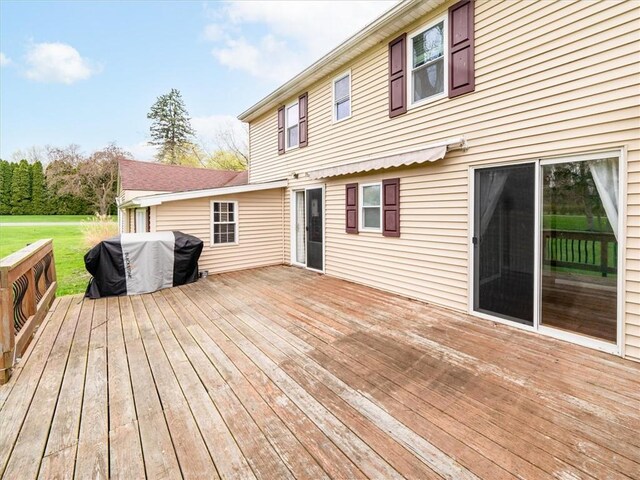 wooden deck with a yard
