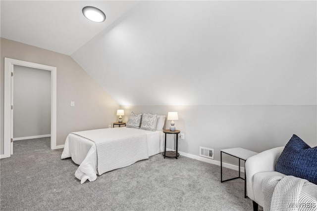 carpeted bedroom featuring visible vents, baseboards, and lofted ceiling