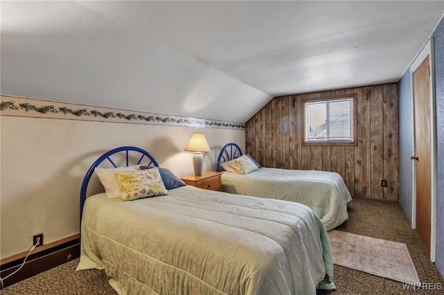 carpeted bedroom with wood walls and vaulted ceiling