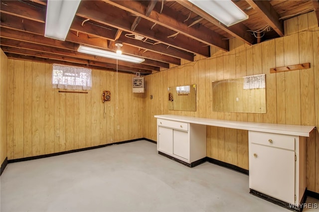 basement with wooden walls and baseboards