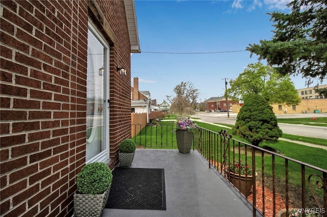 exterior space featuring a porch and a residential view