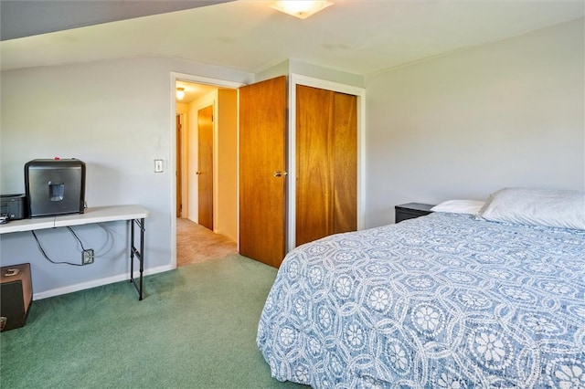 carpeted bedroom featuring baseboards and a closet
