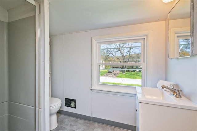 full bath with vanity, a shower with door, a wealth of natural light, and toilet