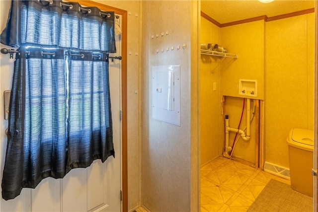 bathroom featuring visible vents, ornamental molding, electric panel, and toilet