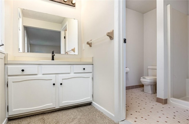 full bathroom featuring vanity, baseboards, toilet, and a shower
