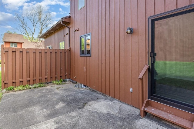 view of side of property featuring a patio area