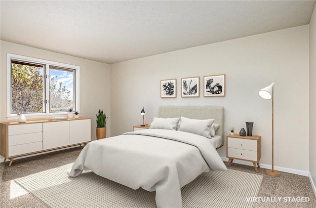 carpeted bedroom featuring baseboards