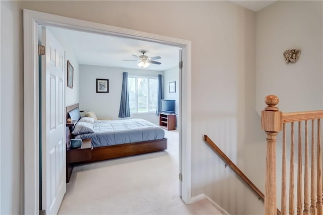 carpeted bedroom featuring a ceiling fan