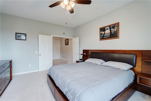 bedroom with baseboards, ceiling fan, and light colored carpet