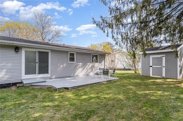 rear view of property featuring an outdoor structure, a lawn, a shed, and a patio area