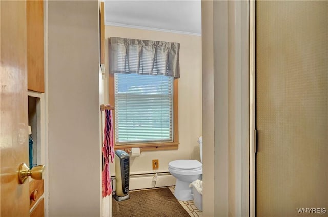 bathroom featuring crown molding, a baseboard radiator, and toilet