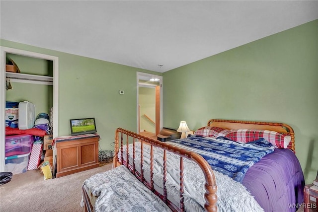 carpeted bedroom with a closet
