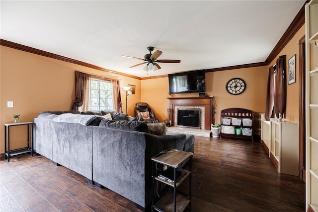 living room featuring crown molding, ceiling fan, and dark wood-style floors