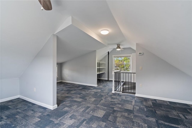 bonus room featuring baseboards, a ceiling fan, carpet, and lofted ceiling