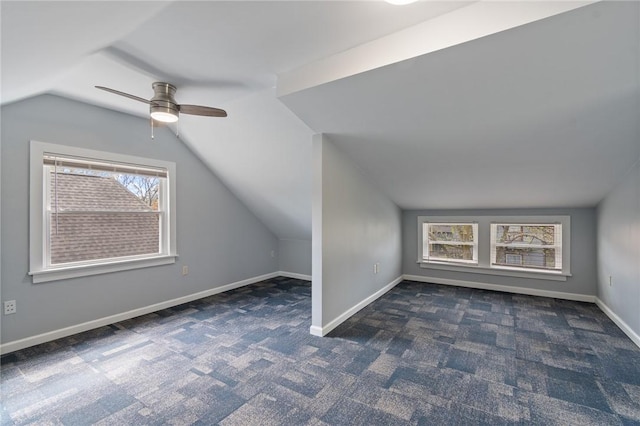 bonus room featuring carpet floors, ceiling fan, baseboards, and lofted ceiling