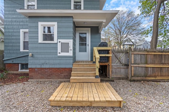 property entrance featuring a gate and fence