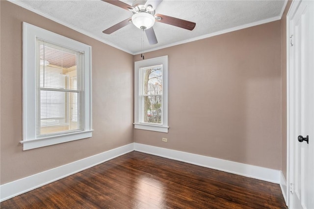 unfurnished room with a textured ceiling, baseboards, dark wood-style floors, and ornamental molding