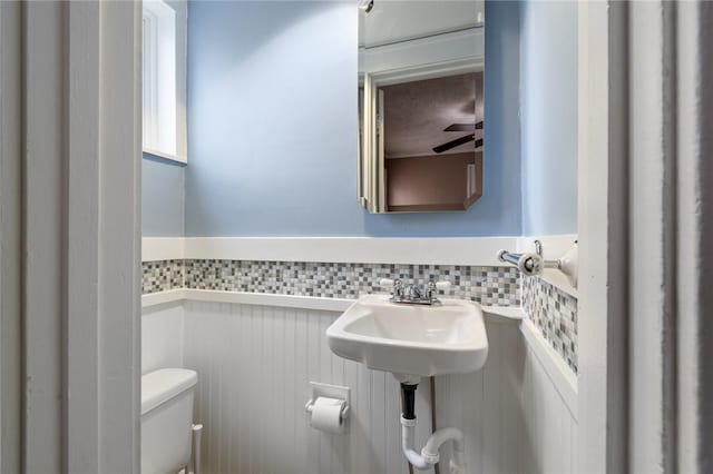 half bathroom featuring toilet