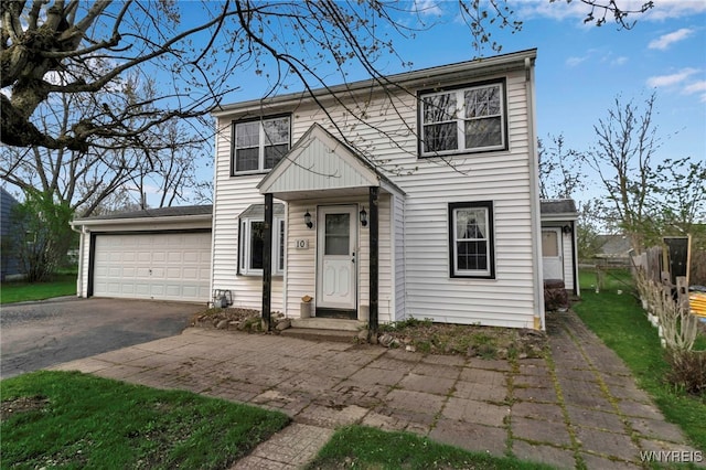 view of front of property featuring a garage and driveway