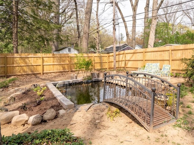 view of yard with a fenced backyard