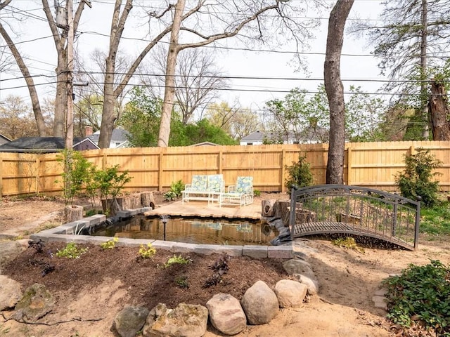 view of yard with a fenced backyard