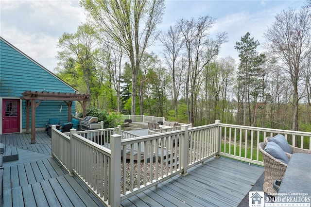 wooden deck featuring a pergola