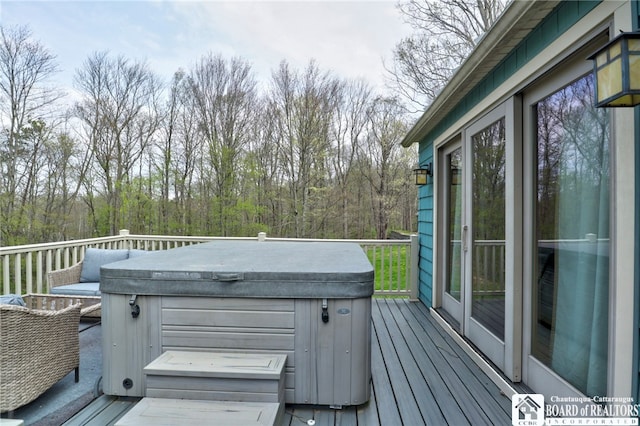 deck featuring a hot tub
