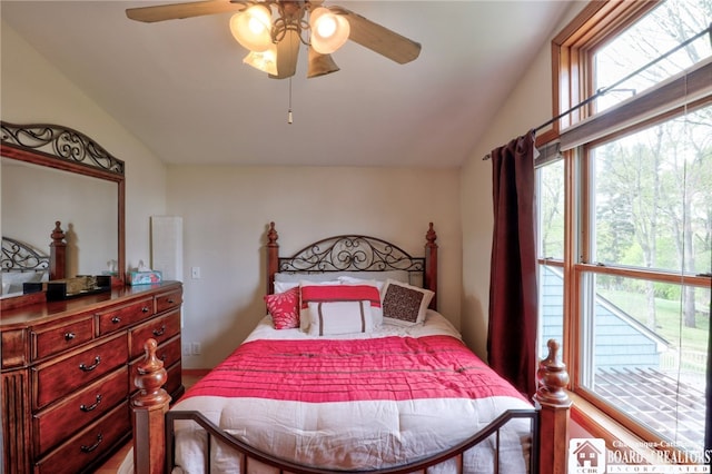 bedroom with ceiling fan and lofted ceiling