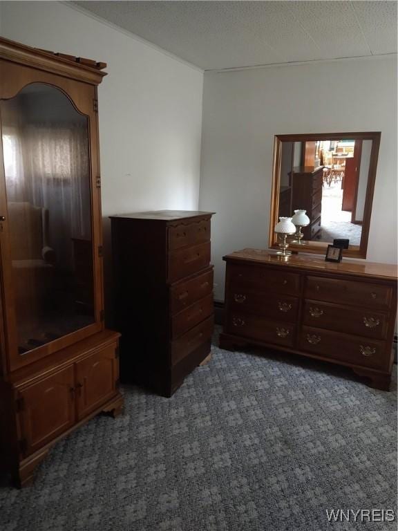 carpeted bedroom with a chandelier