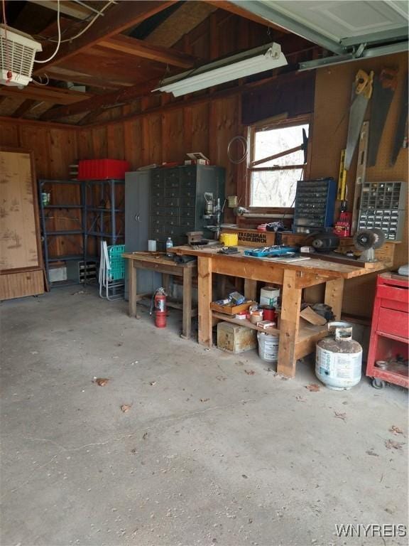 garage with a workshop area
