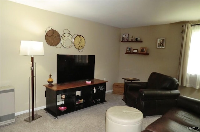 living room with carpet floors and baseboards