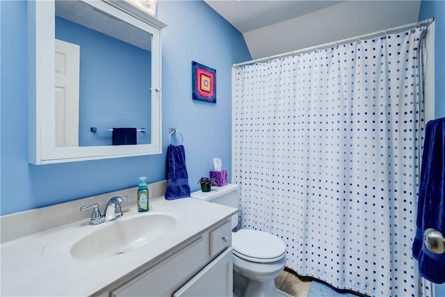 full bathroom with vanity, a shower with shower curtain, and toilet