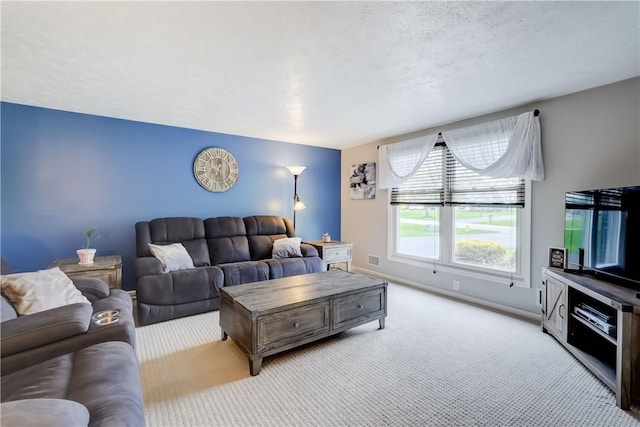 living area featuring carpet floors, baseboards, and visible vents