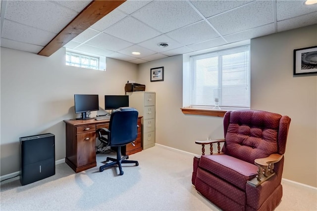 carpeted office featuring baseboards and a paneled ceiling