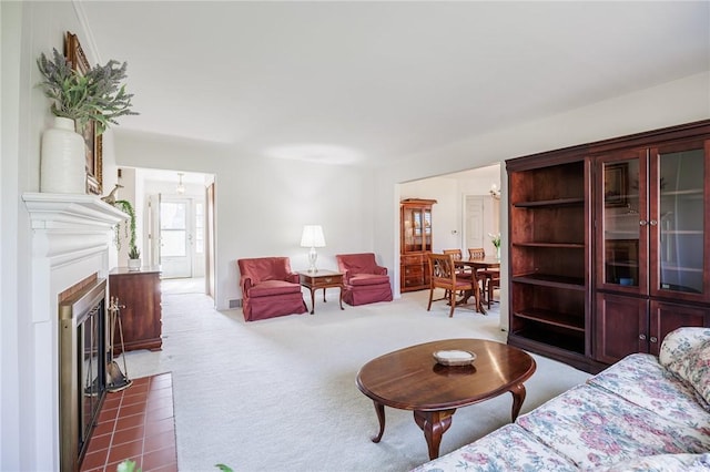 carpeted living room featuring a fireplace with flush hearth