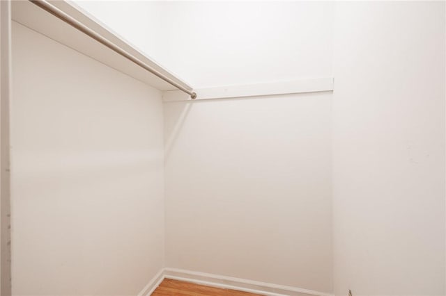 spacious closet with light wood-style floors