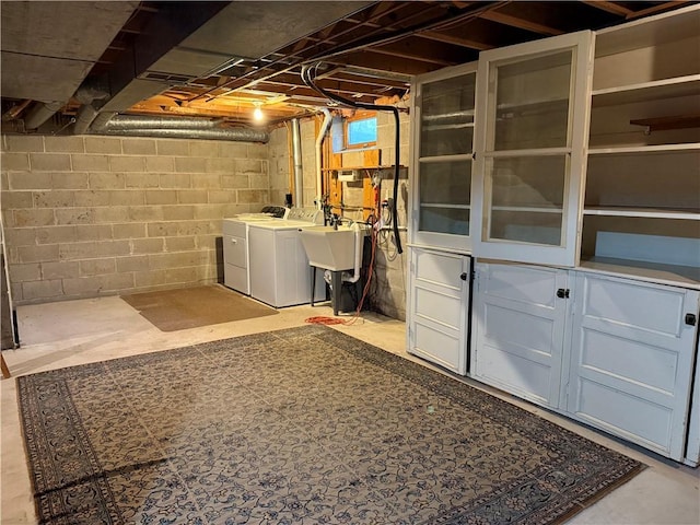 unfinished basement with washing machine and clothes dryer