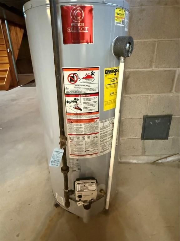 utility room featuring gas water heater