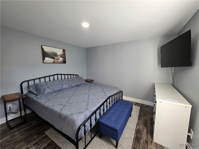 bedroom with baseboards, recessed lighting, and wood finished floors