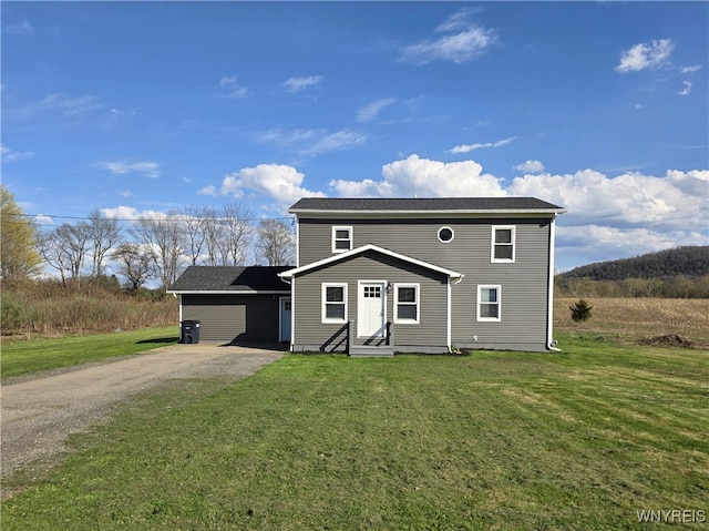 traditional home with entry steps, a front yard, and dirt driveway