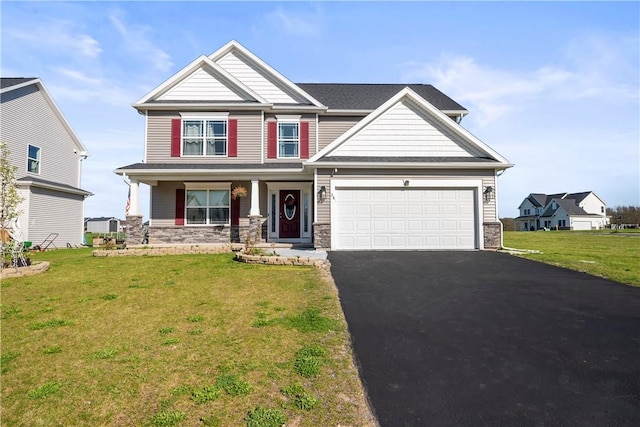 craftsman-style home with covered porch, driveway, and stone siding