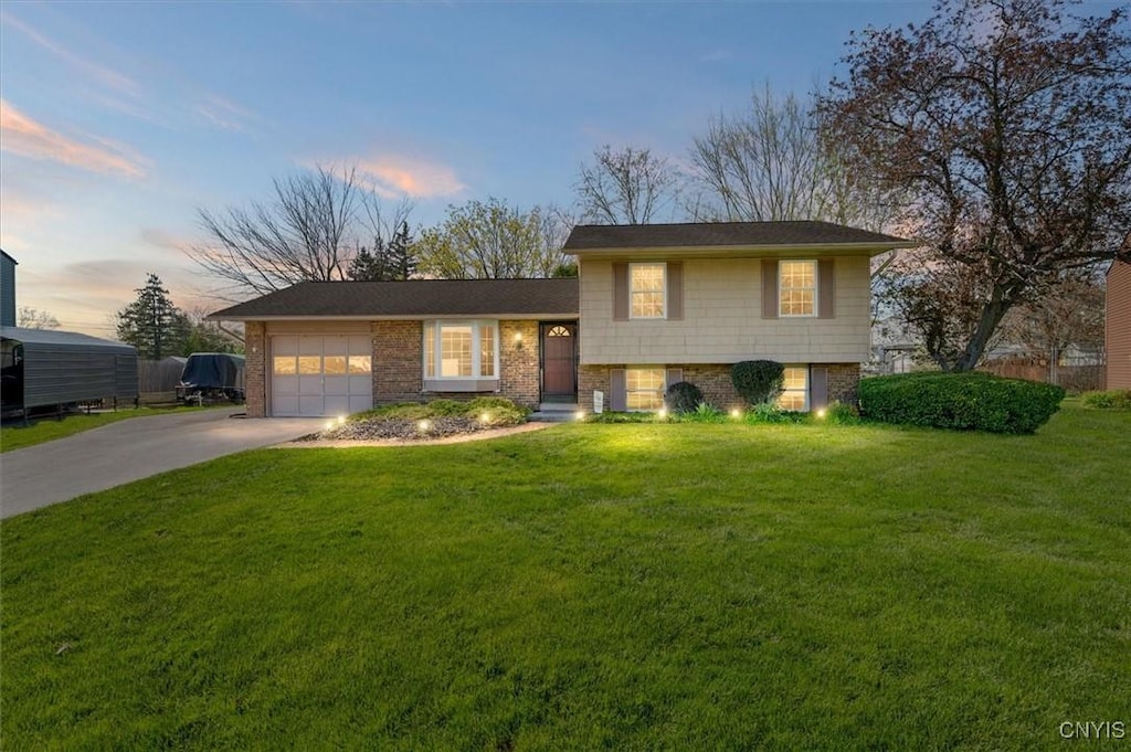 8010 Bamm Hollow Rd, Clay, NY 13041 - tri-level home with a garage, a front lawn, and driveway