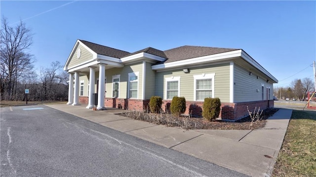 view of front of house featuring brick siding