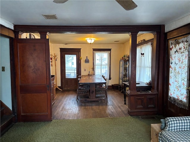 2384 State Highway 205, Laurens, NY 13810 - dining space with visible vents, decorative columns, ornamental molding, and hardwood / wood-style flooring