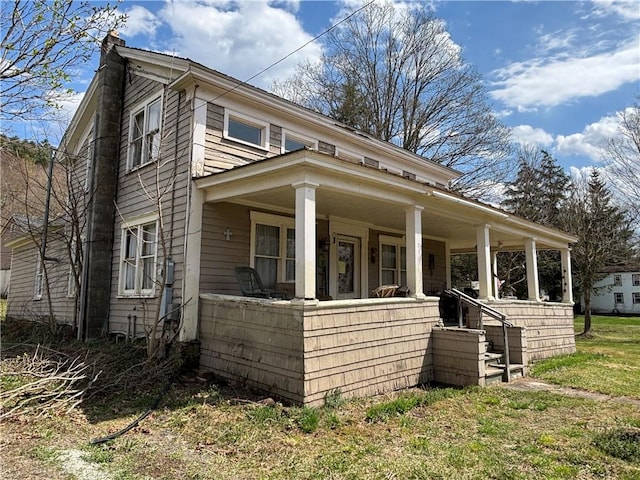2384 State Highway 205, Laurens, NY 13810 - view of front of property featuring a porch and a chimney