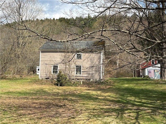 2384 State Highway 205, Laurens, NY 13810 - view of property exterior with a yard and crawl space