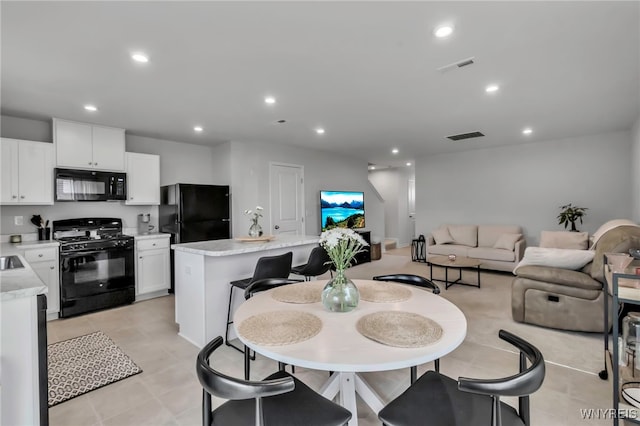 dining room with recessed lighting, visible vents, and light tile patterned floors